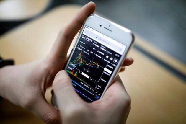 Eoh Kyung-hoon, leader of a club studying cryptocurrencies, checks a chart after a meeting at a university in Seoul Dec. 20, 2017.