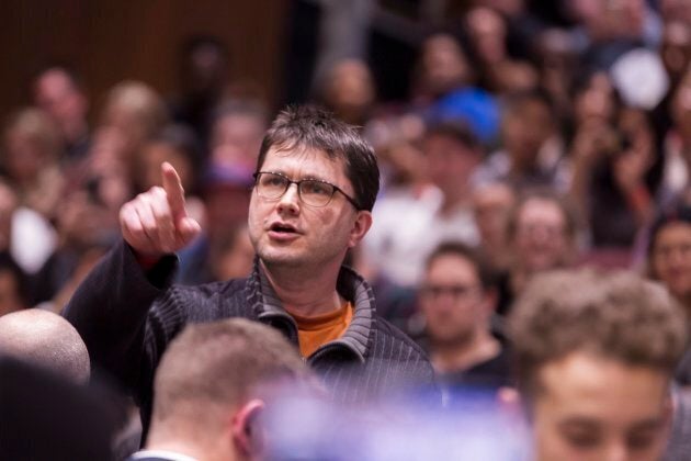 A man heckles Prime Minister Justin Trudeau during a town hall event at Western University in London, Ont., on Jan. 11, 2018.