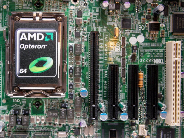 An AMD processor shown on a motherboard.