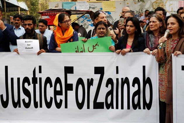 People hold signs to condemn the rape and killing of Zainab Ansari during a protest in Karachi, Pakistan. Jan. 11, 2018.