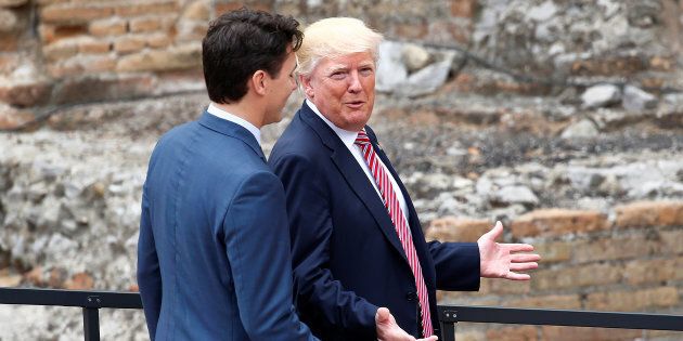 U.S. President Donald Trump and Prime Minister Justin Trudeau talk during the G7 summit in Taormina, Sicily, Italy, on May 26, 2017.