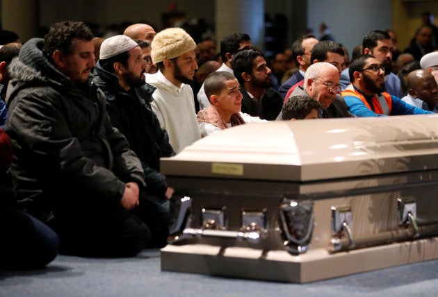 Mourners listen during funeral services for three of the victims of the deadly shooting at the Quebec Islamic Cultural Centre, at the Congress Centre in Quebec City, on Feb. 3, 2017.