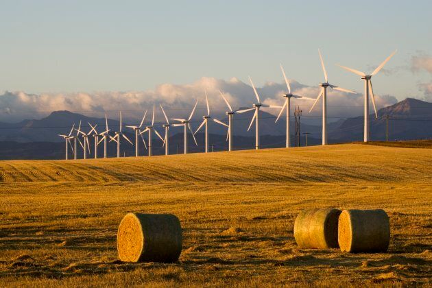 Windmills used for power generation at sunrise, near Pincher Creek, Alberta.