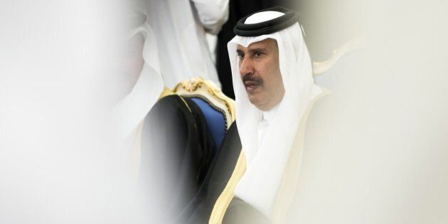 Qatari former Prime Minister Sheik Hamad bin Jassem bin Jabr al-Thani attends a ceremony with dignitaries and leaders from around the world offering their condolences to new King Salman on January 24, 2015 at the Diwan royal palace in Riyadh, Saudi Arabia, a day after the death of King Abdullah. One after another, foreign aircraft landed at a Riyadh military base where leaders from Africa, Europe and Asia descended a red-carpeted ramp to be welcomed by officials and served a traditional tiny cup of Arabic coffee. AFP PHOTO / POOL / YOAN VALAT (Photo credit should read YOAN VALAT/AFP/Getty Images)