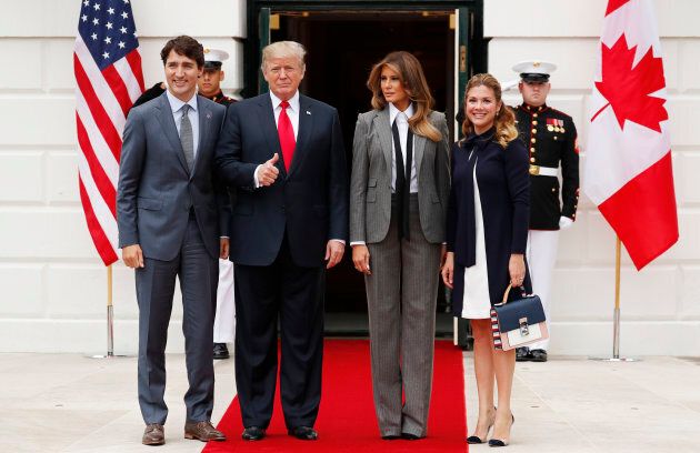 U.S. President Donald Trump gives a thumbs up as he and first lady Melania Trump welcome Prime Minister Justin Trudeau and his wife Sophie Gregoire Trudeau to the White House on Oct. 11, 2017.
