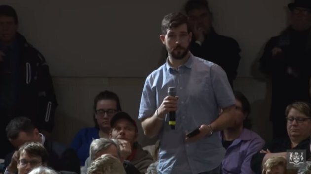 A man asks Ontario Premier Kathleen Wynne a question about the effect of the province's minimum wage increase at a town hall in Nepean, Ont. on Jan. 18, 2018.