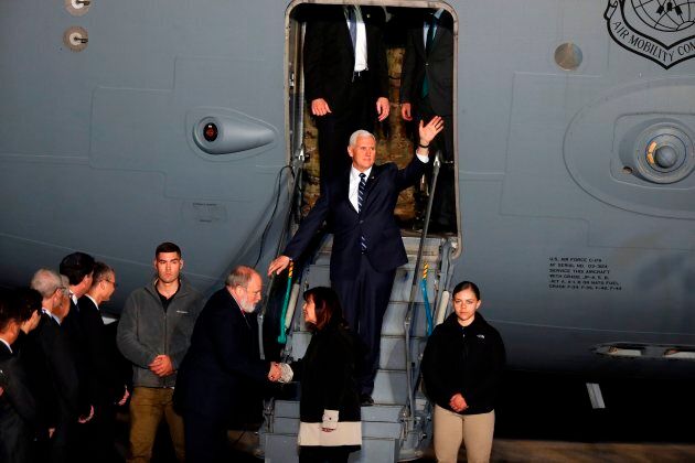 US Vice President Mike Pence waves as he steps off a US Air Force C-17 plane upon arrival at Ben Gurion Airport near Tel Aviv, Israel.