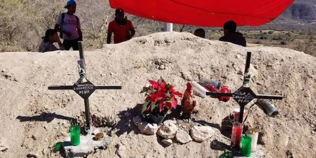 Community residents in Guerrero state in Mexico watch over a memorial for two demonstrators killed Nov. 18, 2017, near the mining operations of Canada's Torex Gold.