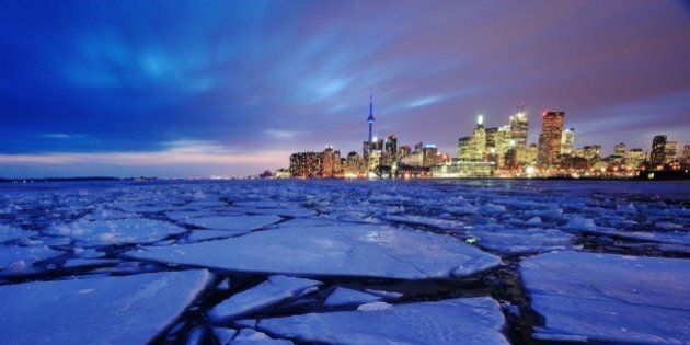 Toronto harbour in winter with ice chunks.