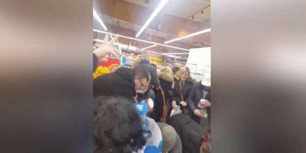 French shoppers shove each other as they try to get their hands on as many pots of Nutella as possible.