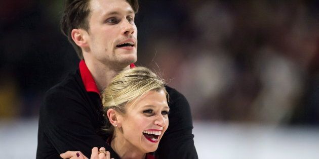 Kirsten Moore-Towers, front, and Michael Marinaro react after performing their short program during the senior pairs competition at the Canadian Figure Skating Championships in Vancouver, B.C., on Jan. 12, 2018.