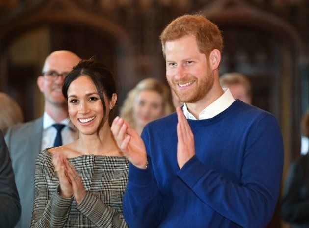Prince Harry and Meghan Markle watch a performace during a visit to Cardiff Castle on Jan. 18.