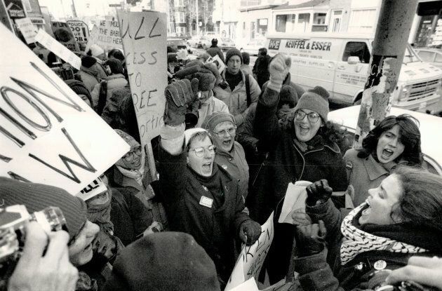 Placard-waving pro-abortion activists break into shouts of jubilation on Jan. 28, 1988, the day a 5-2 ruling by the Supreme COurt struck down Canada's abortion law. The ruling ended Dr. Henry Morgentaler's 18 years of battling prosecutions on charges of performing illegal abortions.