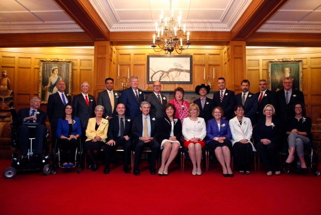 B.C. Premier Christy Clark, centre, and her Liberal cabinet after being sworn in in Victoria, B.C. on June 12, 2017.