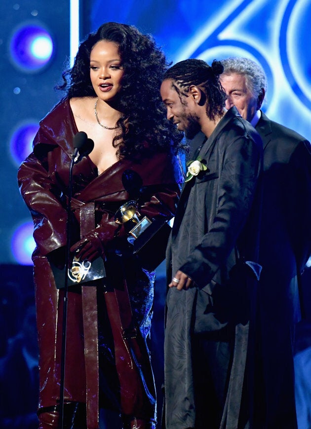 Rihanna and Kendrick Lamar accept the award for Best Rap/Sung Performance onstage.