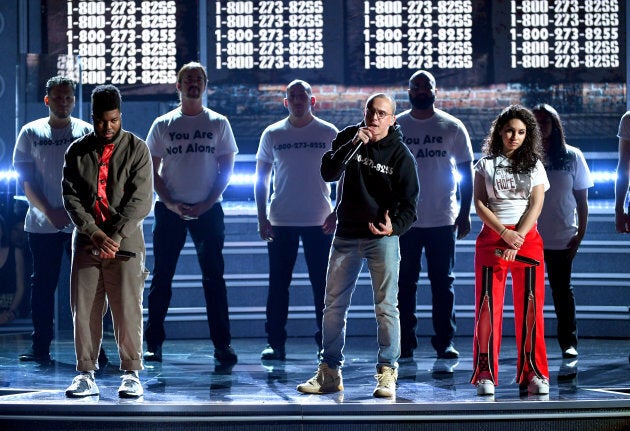 Artists Khalid (left), Logic (middle), and Alessia Cara (right), perform during the Grammy Awards.