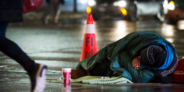 A homeless person is seen in downtown Toronto, Jan. 3, 2018. A new survey from the World Economic Forum shows Canada's economy, though strong on the surface, is leaving many people out in the cold.