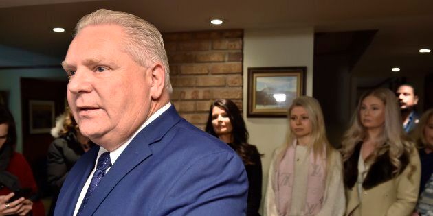 Former Toronto city councillor Doug Ford holds a news conference in Toronto on Jan.29, 2018 as family members look on.