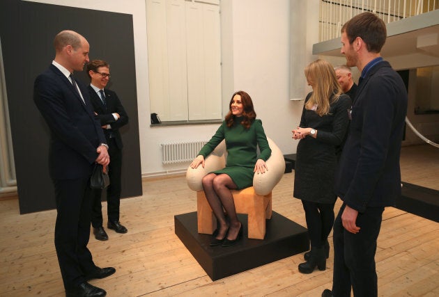 The Duchess of Cambridge tries out a chair as she visits the ArkDes museum during her royal visit to Sweden.