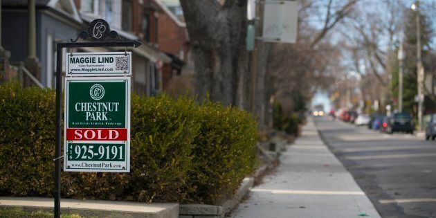 A for sale sign for a house in Toronto's St. Clair and Arlington neighbourhood. New polling data from the city's real estate board suggests many first-time home buyers are giving up on the city.