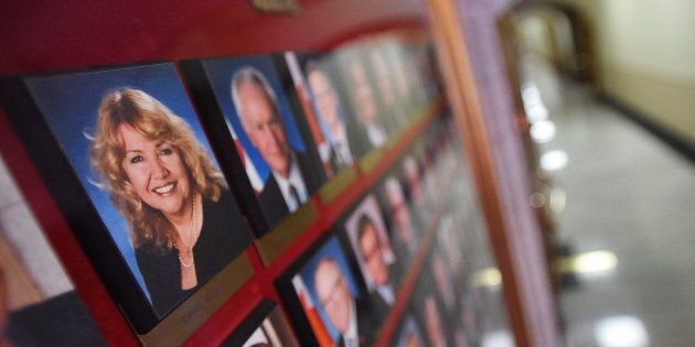 A picture of Senator Lynn Beyak accompanies other Senators official portraits on a display outside the Senate on Parliament Hill in Ottawa on Sept. 21, 2017.