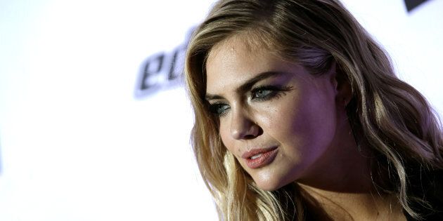 Model Kate Upton poses for photographers at a launch event for the 2017 Sports Illustrated Swimsuit Issue in New York City, Feb.16, 2017. Guess Inc shares fell more than 17 percent on Thursday following a tweet by model and actress Kate Upton accusing the company's co-founder of using his power to harass women.