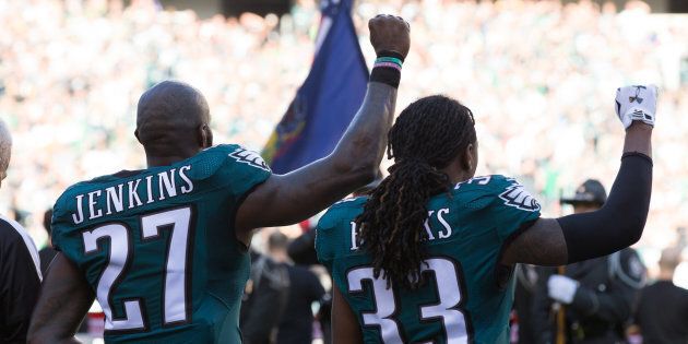 Philadelphia Eagles strong safety Malcolm Jenkins and defensive back Ron Brooks hold up fists during the national anthem before a game against the Pittsburgh Steelers at Lincoln Financial Field.