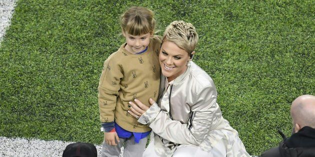 Recording artist Pink poses with her daughter before singing the US National Anthem for the start of Super Bowl LII on February 4, 2018 in Minneapolis, Minnesota.