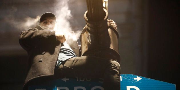 A fan celebrates in Center City after the Philadelphia Eagles defeated the New England Patriots to win the Super Bowl on Feb. 4, 2018 in Philadelphia, Pennsylvania.