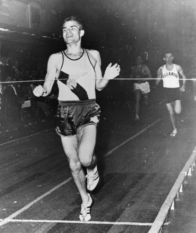 Author Bruce Kidd crosses the finish line to win a race in Philadelphia in this 1963 file photo.
