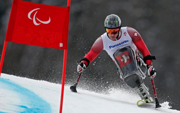Switzerland's Christoph Kunz skis during the Men's Sitting Skiing event of the Giant Slalom at the 2014 Sochi Paralympic Winter Games at the Rosa Khutor Alpine Center, March 15, 2014.