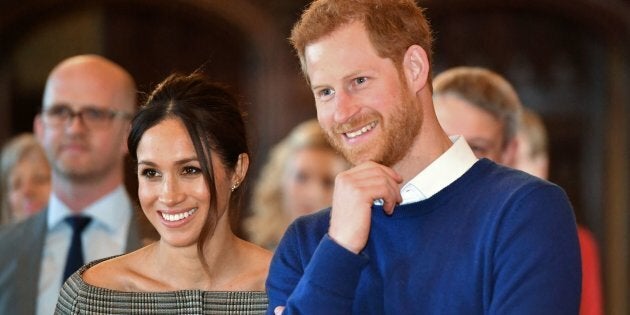 Prince Harry and Meghan Markle watch a performace during a visit to Cardiff Castle on Jan. 18.