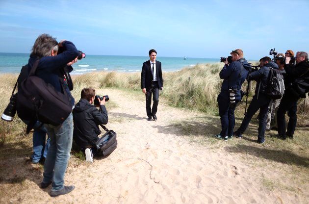 Press photographers gather as Justin Trudeau leaves Juno beach on April 10, 2017 in Courseulles-sur-Mer, northwestern France. Juno Beach was one of five beaches of the Allied invasion of German-occupied France in the Normandy landings on June 6, 1944 during the Second World War.