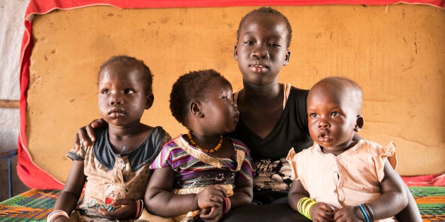 Nyahok, 11, has been displaced several times by war in South Sudan. School is a distant memory, as she looks after children in a camp for internally displaced people.