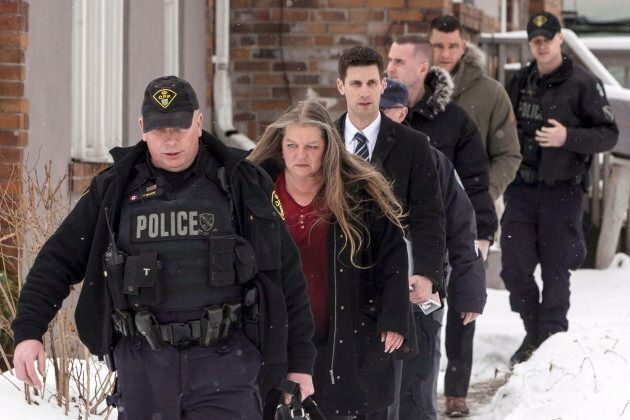Forensic Anthropologist Professor Kathy Gruspier (second left) is seen on Feb. 8, 2018, with police officers at a Toronto property where alleged serial killer Bruce McArthur worked.