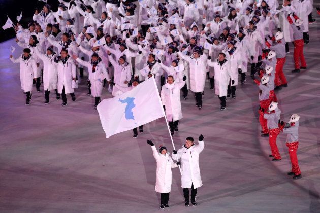 Flag bearers Chung Guam Hwang and Yunjong Won of Republic of Korea leads the team during the opening ceremony.