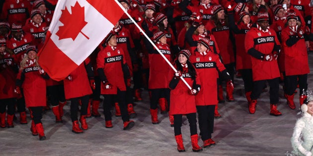 Flag bearers Tessa Virtue and Scott Moir of Canada lead the team during the Opening Ceremony of the PyeongChang 2018 Winter Olympic Games, on Friday in Pyeongchang, South Korea.