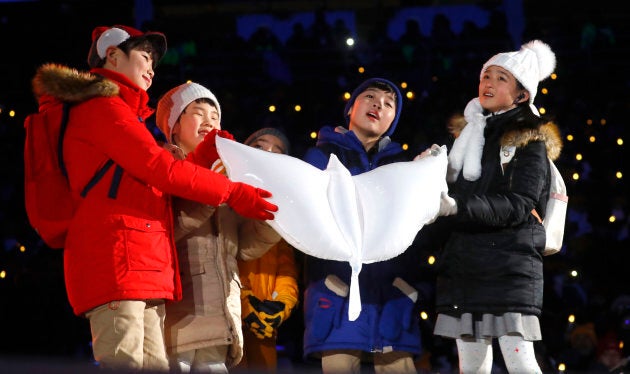 Children release a white dove during the opening ceremony at the PyeongChang 2018 Winter Olympics.