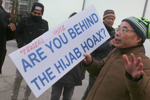 Asian Canadians protested in Toronto, Ont. on Jan. 29, 2018, to demand apologies following the revelation that an 11-year-old Muslim girl's story that an Asian man had cut her hijab while she walked to school was untrue.