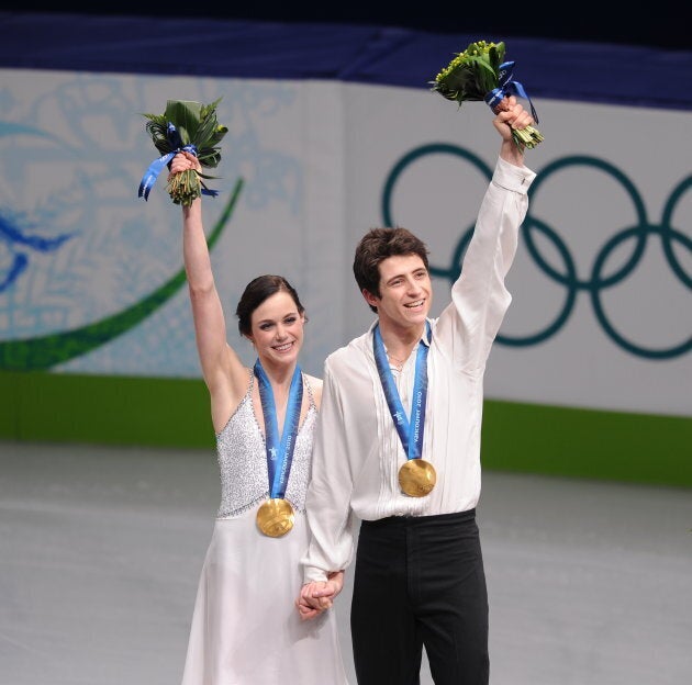 Virtue and Moir pose on the podium after winning the 2010 Winter Olympics ice dance figure skating competition in Vancouver on Feb. 22.