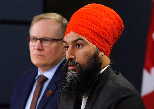 NDP leader Jagmeet Singh, right, and NDP finance critic Peter Julian speak at a press conference in the National Press Theatre in Ottawa on Feb. 13, 2018.
