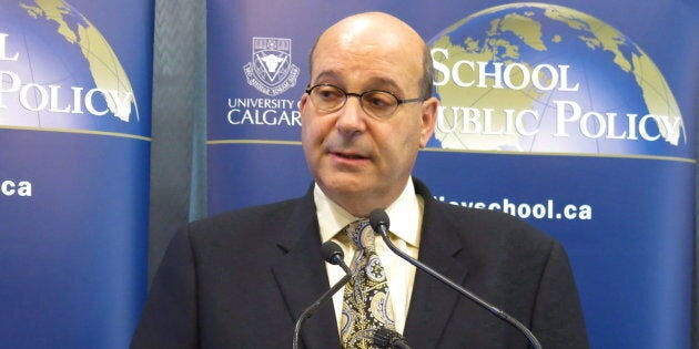Jack Mintz of the School of Public Policy at the University of Calgary speaks to reporters in Calgary on Sept. 24, 2013.