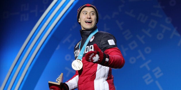 Patrick Chan of Team Canada celebrates during the medal ceremony after the Figure Skating Team Event on Feb. 12 in PyeongChang.