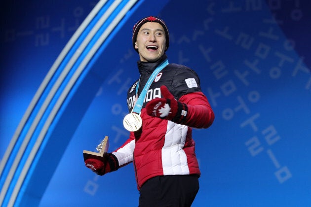 Patrick Chan celebrates during the medal ceremony after the Figure Skating Team Event in PyeongChang on Feb. 12.