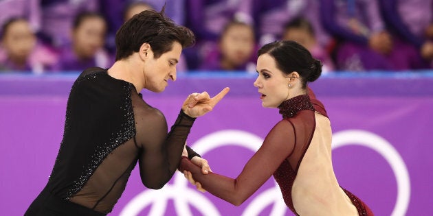 Tessa Virtue and Scott Moir of Canada compete in the free dance segment of the ice dance.
