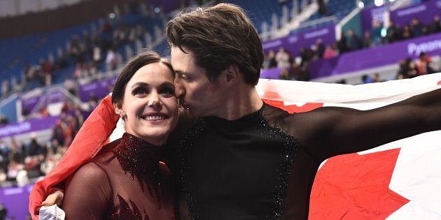 Tessa Virtue and Scott Moir celebrate after the ice dance free dance during the 2018 Olympics.