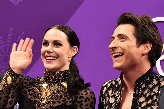 Virtue and Moir react after competing in the ice dance short dance figure skating event during the 2018 Winter Games.