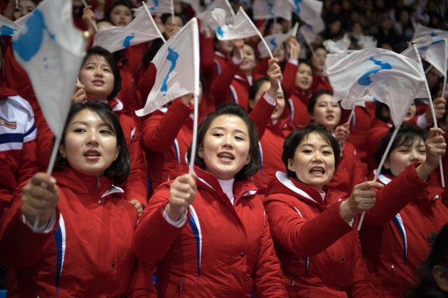 North Korean cheerleaders wave unified Korean flags as they perform during the PyeongChang Olympics.