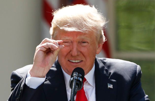 United States President Donald Trump refers to amounts of temperature change as he announces his decision that the U.S. will withdraw from the landmark Paris Climate Agreement, in the Rose Garden of the White House in on June 1, 2017.