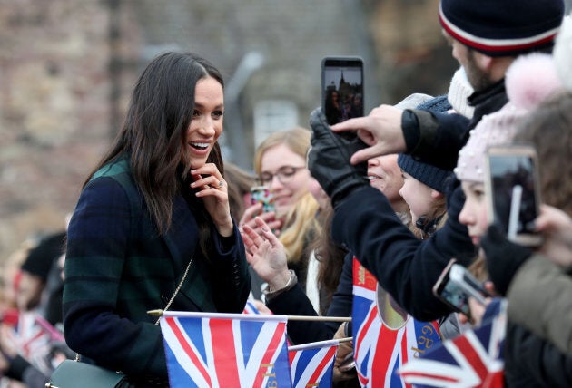 Meghan Markle meets members of the public during a walkabout at Edinburgh Castle.